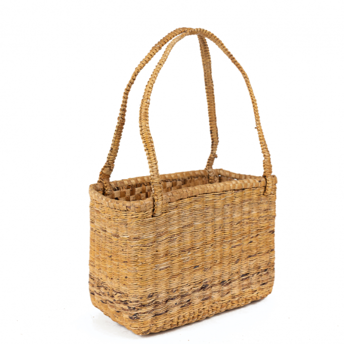 Woven basket with handles on a white background