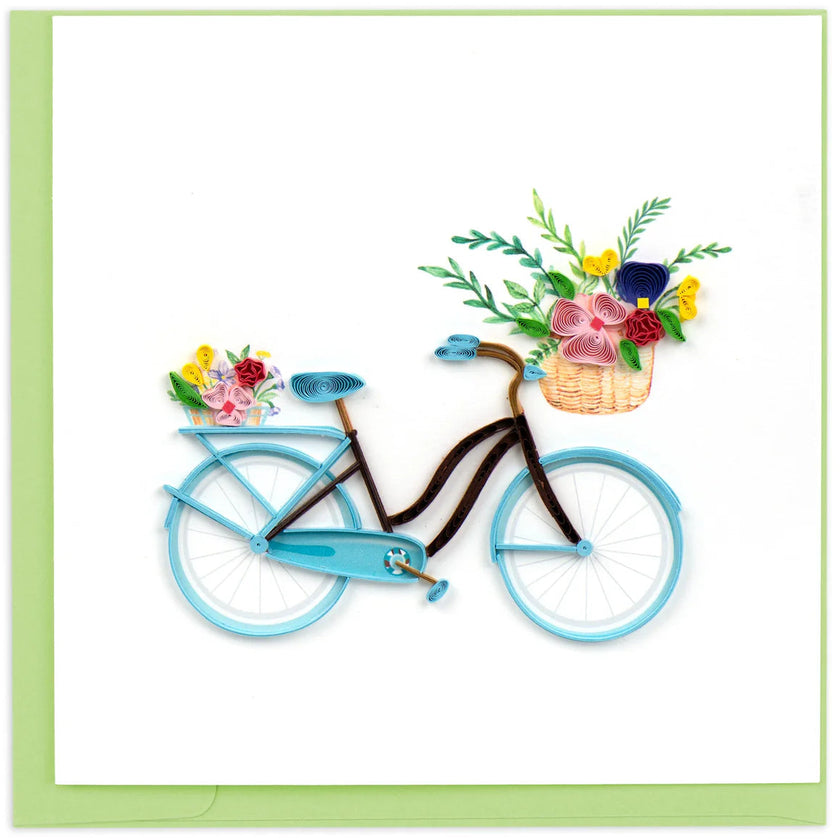 Blue bicycle with flower baskets on a white background