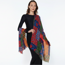 Switch Woman wearing a colorful patterned scarf on a white background. 3 image
