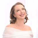 Switch Woman wearing a pearl necklace and earrings on a white background 1 image