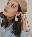 Switch White tassel earring on model 3 image