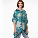 Switch Woman wearing a blue floral patterned poncho on a white background 1 image