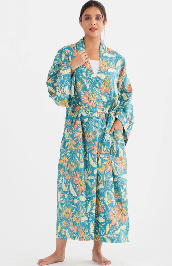 Woman wearing a floral patterned robe on a white background