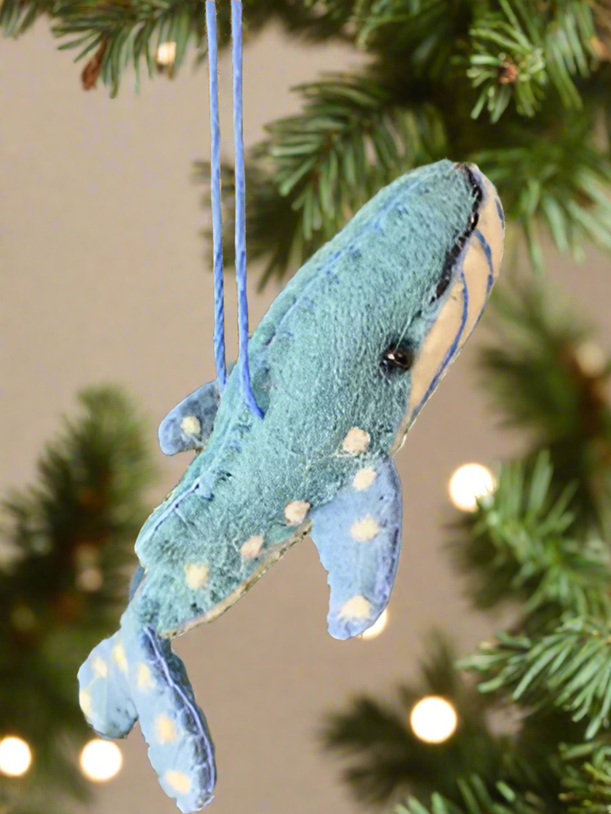 humpback whale ornament hanging nose up on a Christmas tree