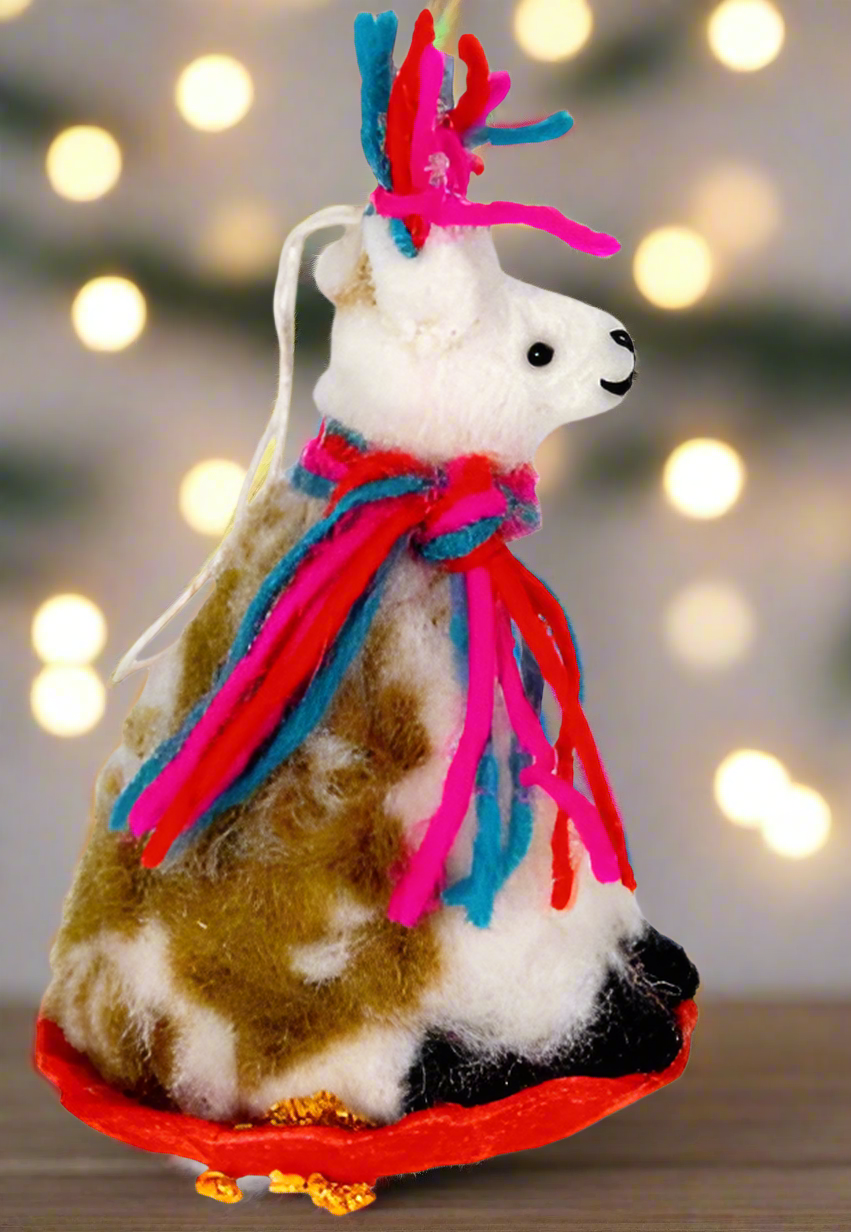 an image of a llama tree ornament riding a sled taken from the side