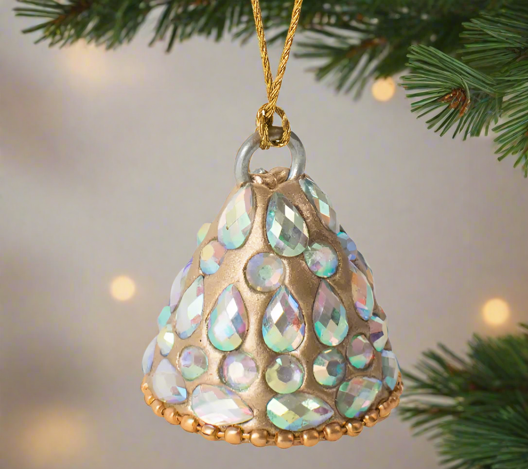 a handmade bell tree ornament encrusted with sparkling gems