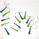 Switch Green tassel garland on a white background 2 image