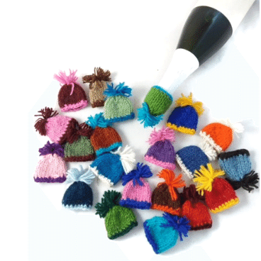 Mini hand-knit hat bottle toppers