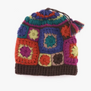 Switch A multicolored handcrafted crochet hat with a variety of colors and patterns, featuring a brown brim and a tassel detail. 2 image