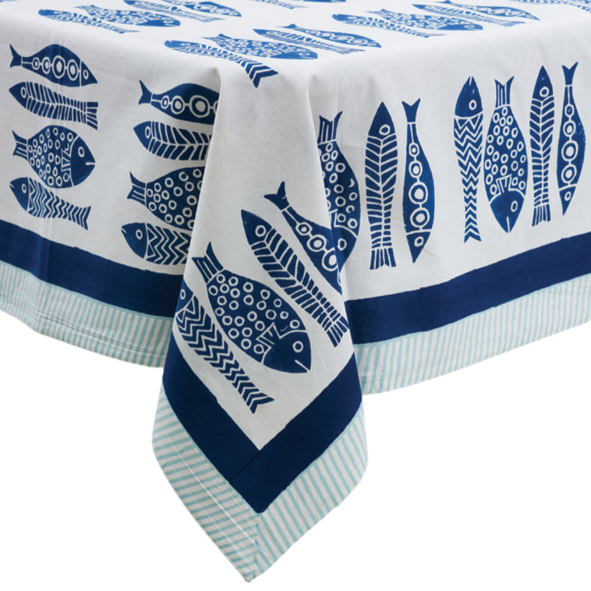 Tablecloth with blue fish pattern on a white background