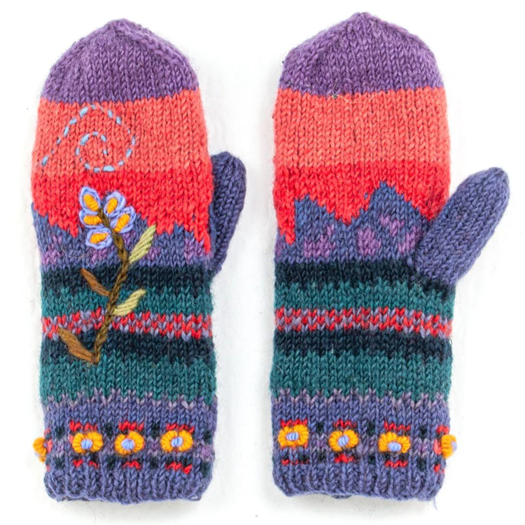 Pair of colorful knitted mittens with floral patterns on a white background