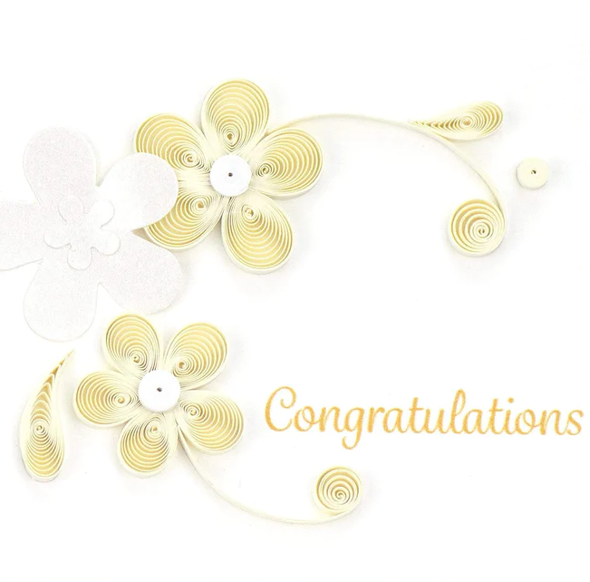 A gift enclosure card with a floral design and the word 'Congratulations' printed on it.