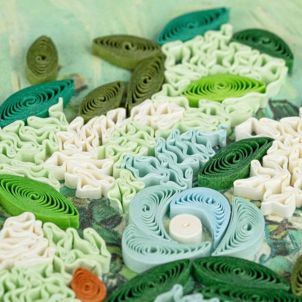 Colorful paper quilling shapes on a textured surface