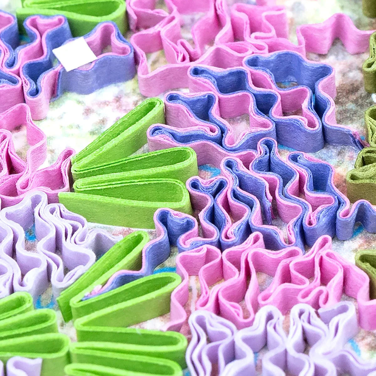 Colorful star-shaped folder paper on a textured surface