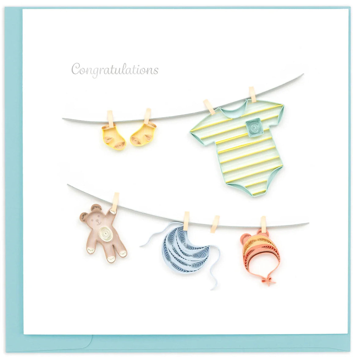 Baby shower card with baby clothes and toys hanging on a line against a light blue background.