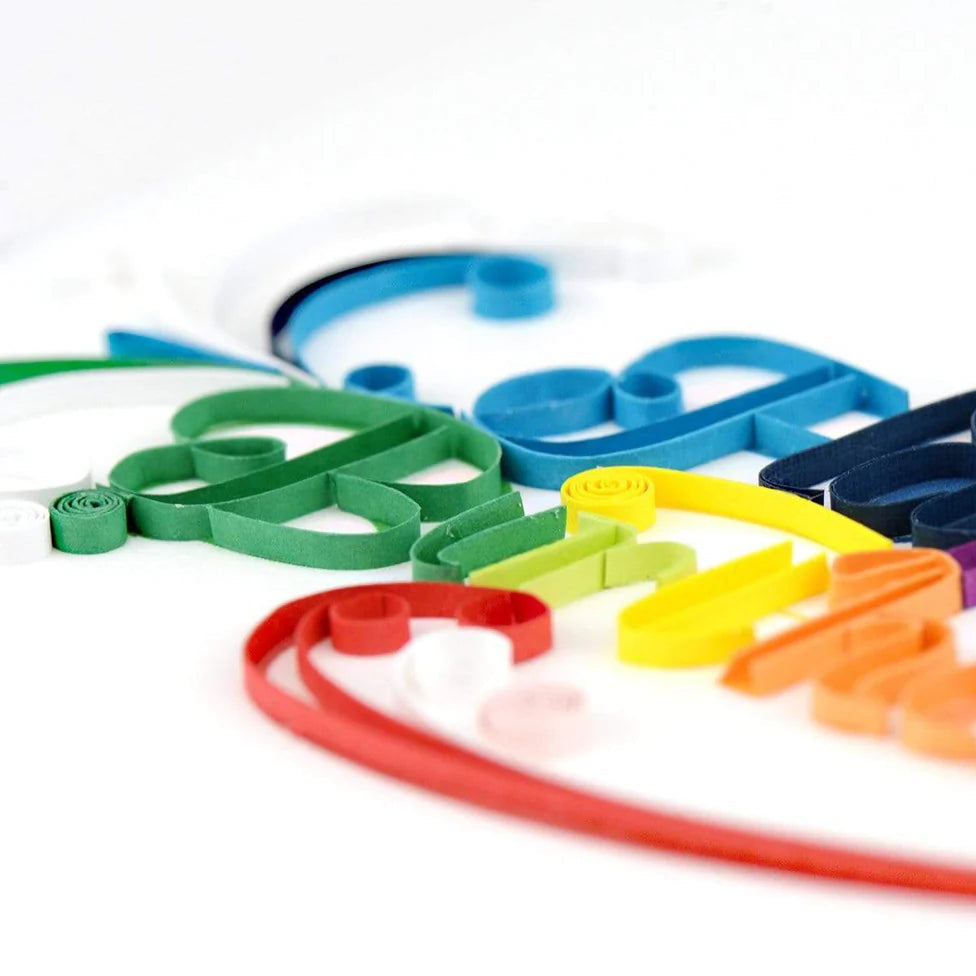 quilled paper script letters for Happy Birthday on a white background