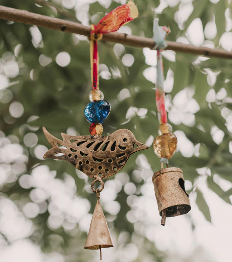 indian bird sari bell charm on a branch