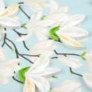 Switch Quilled white flowers with green stems on a light blue background 2 image
