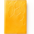 Switch A yellow leather journal with an embossed floral design on the cover. 2 image