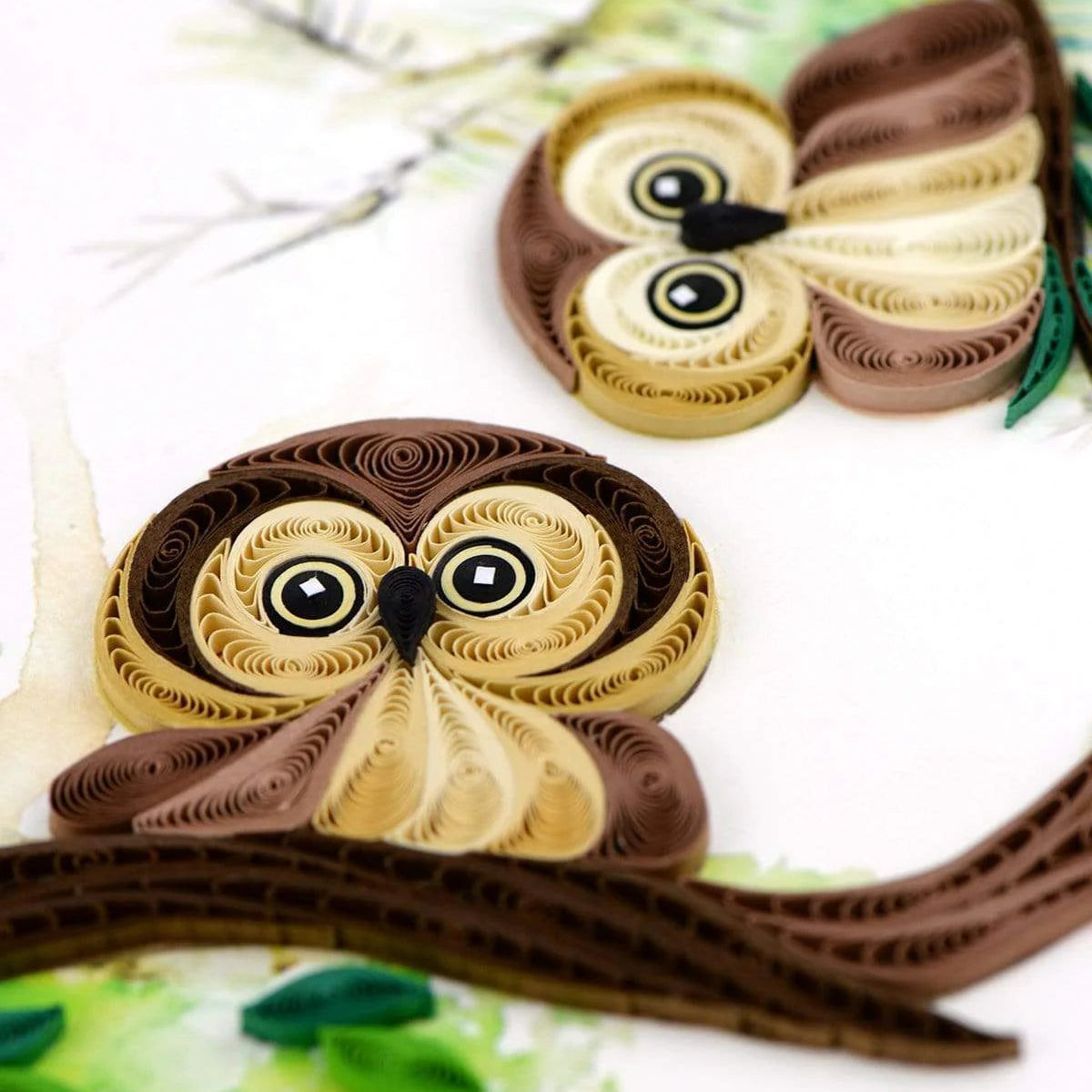 Quilled owl design on a white background