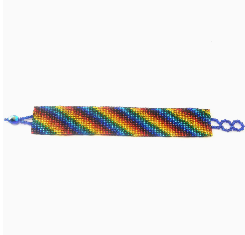A beaded bracelet with a geometric pattern using multiple colors.