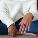 Switch Person wearing a colorful ring on a blurred background 2 image