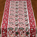 Switch Decorative table runner with intricate patterns on a wooden surface 2 image