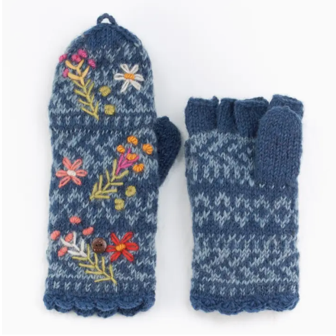 A pair of women's wool knit finger mittens with a floral pattern on a blue background