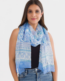 Switch Woman wearing a blue patterned scarf on a white background 3 image