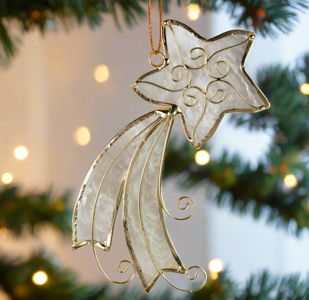 A handmade Shooting Star tree ornament made from capiz shell