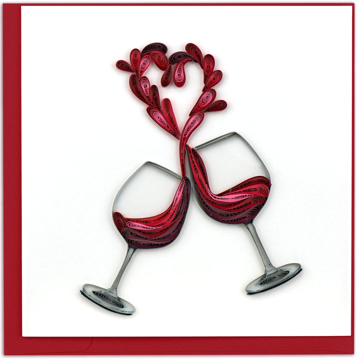 Two interlocking wine glasses with red liquid on a white background