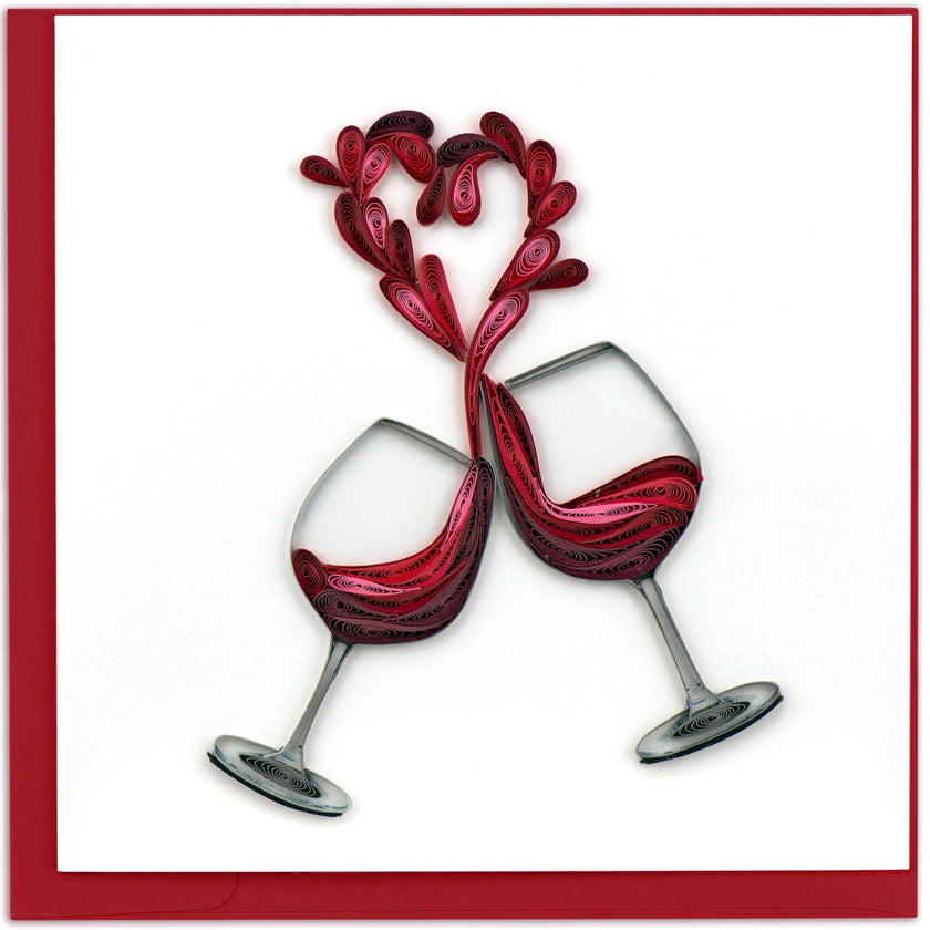 Two interlocking wine glasses with red liquid on a white background