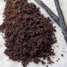 Switch Ground and whole vanilla beans on a white surface 2 image