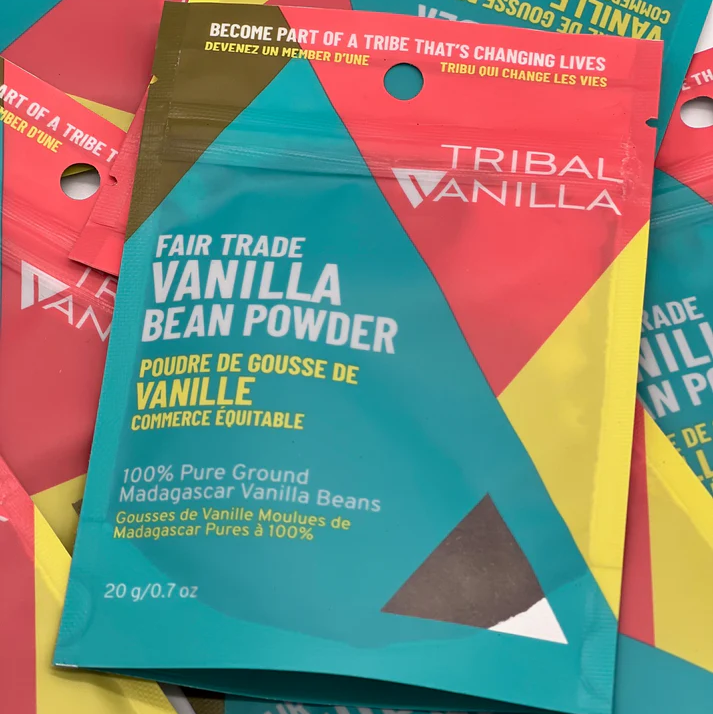 Tribal Vanilla fair trade vanilla bean powder packages on a colorful background