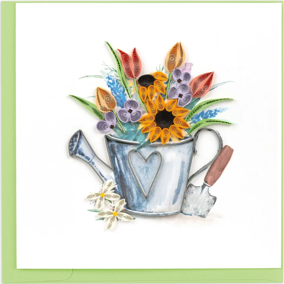 Decorative card with a silver watering can holding colorful flowers on a white background.