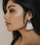 Switch white tassel earrings on model in profile 2 image