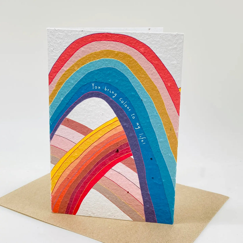 Colorful rainbow-shaped card with text on a white background